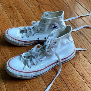 A pair of white high top converse!